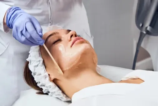 An expert dermatologist performs Anti-Aging Peel at Uncover