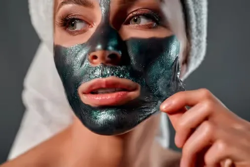 Black Peel Mask on women's face Image