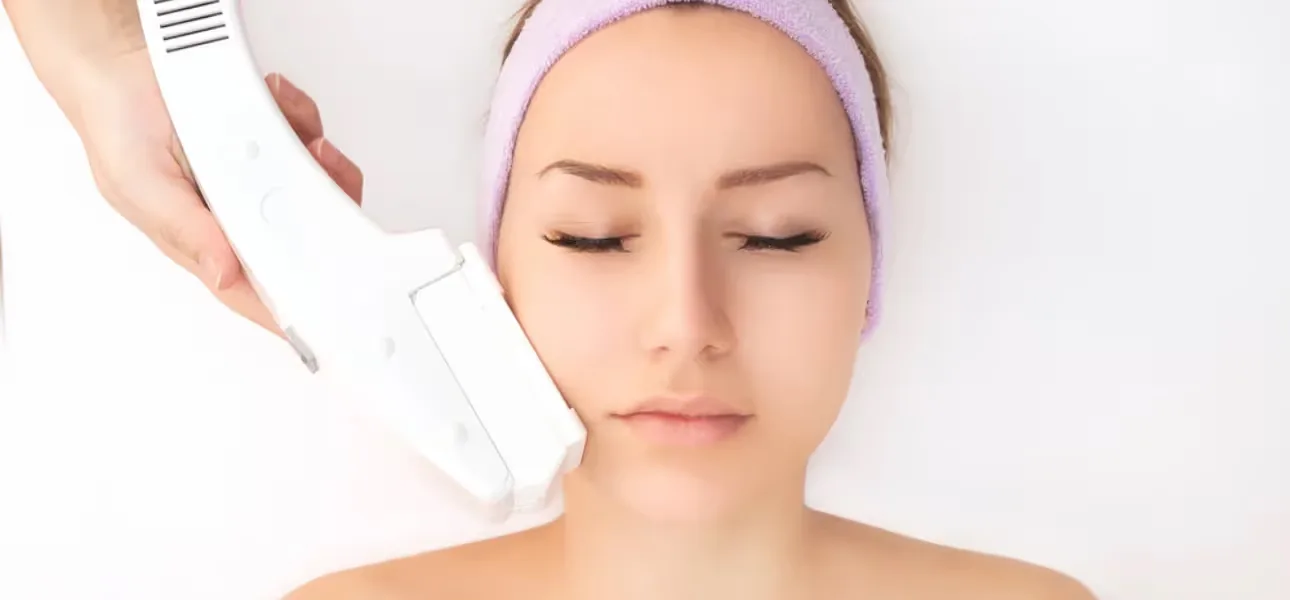 A dermatologist performs Photo Facial treatment