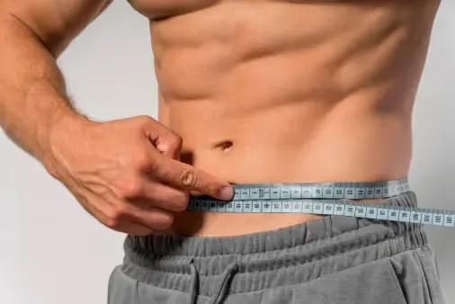 Men Checking results of weight management program